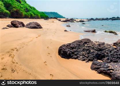 Human footprints on a sandy beach on the island