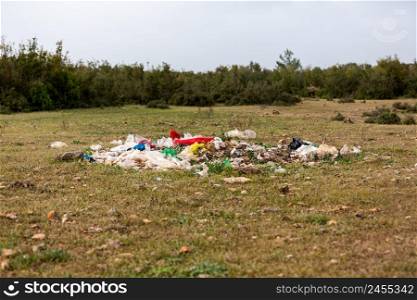 Human garbage thrown into the clean nature. environmental pollution
