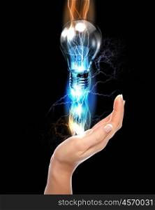 human hand, electric charge and light bulb