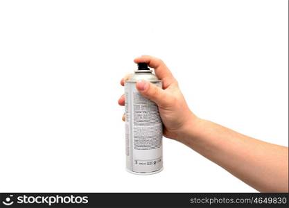 Human hand holding a graffiti Spray over white