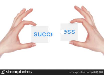 Human hand holding a piece of puzzle with business word