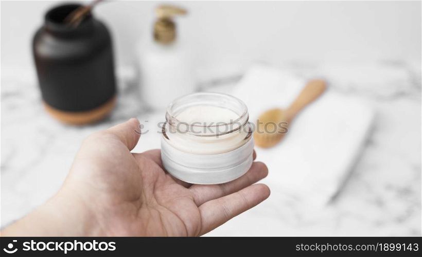 human hand holding jar moisturizing cream. Resolution and high quality beautiful photo. human hand holding jar moisturizing cream. High quality beautiful photo concept