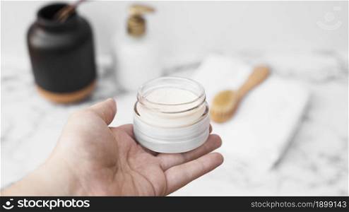 human hand holding jar moisturizing cream. Resolution and high quality beautiful photo. human hand holding jar moisturizing cream. High quality beautiful photo concept