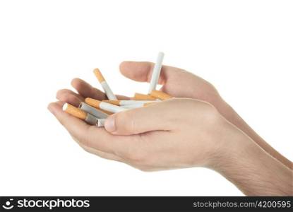 Human hand holding many cigarettes on white background
