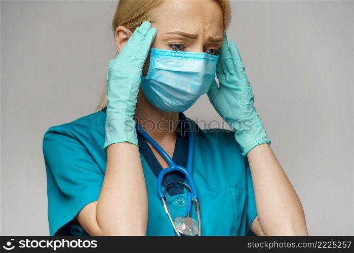 Human hand in protective glove holding face protective masks isolated on white background with clipping path.. Human hand in protective glove holding face protective masks isolated on white background with clipping path