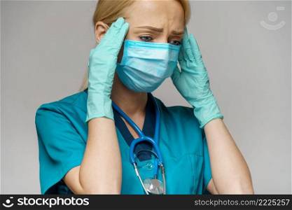 Human hand in protective glove holding face protective masks isolated on white background with clipping path.. Human hand in protective glove holding face protective masks isolated on white background with clipping path