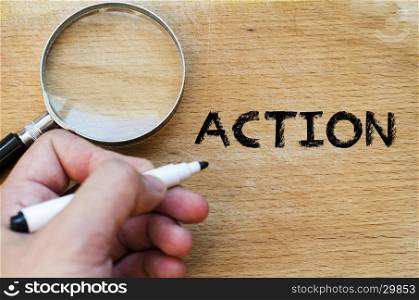 Human hand over wooden background and action text concept