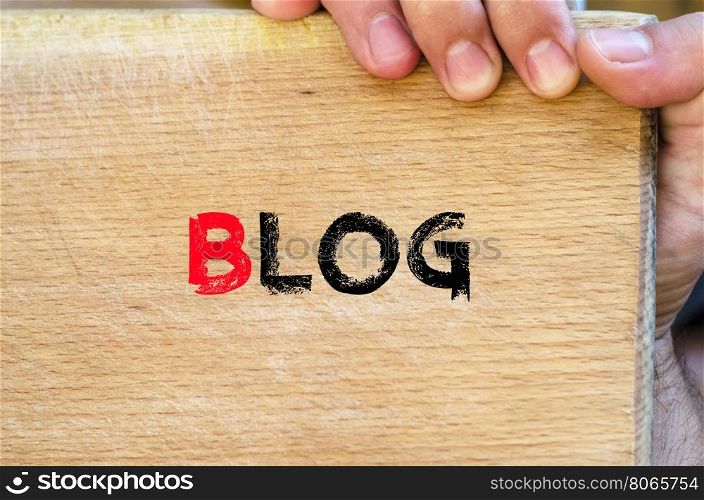 Human hand over wooden background and blog text concept
