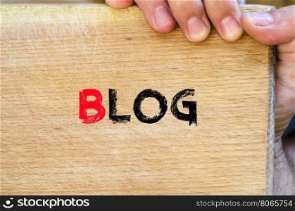 Human hand over wooden background and blog text concept