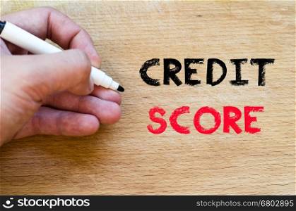 Human hand over wooden background and credit score text concept