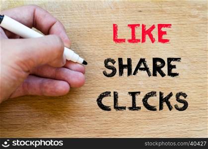 Human hand over wooden background and like share clicks text concept