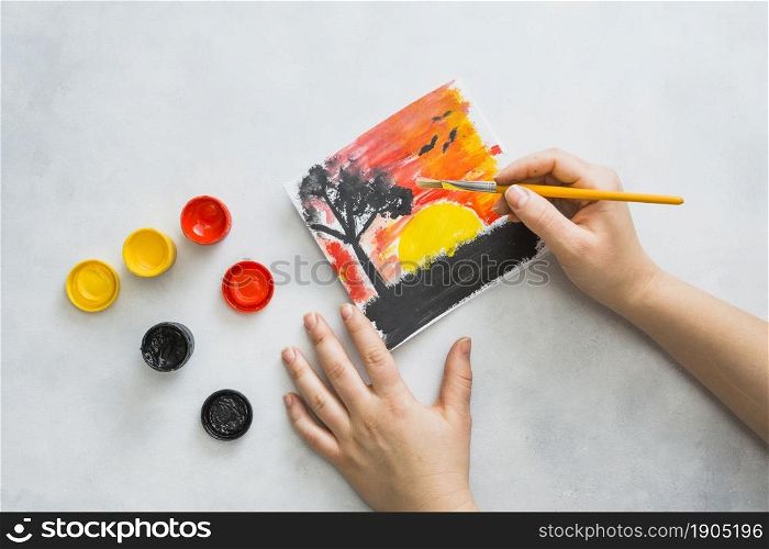 human hand painting beautiful scenery seen paper. Beautiful photo. human hand painting beautiful scenery seen paper