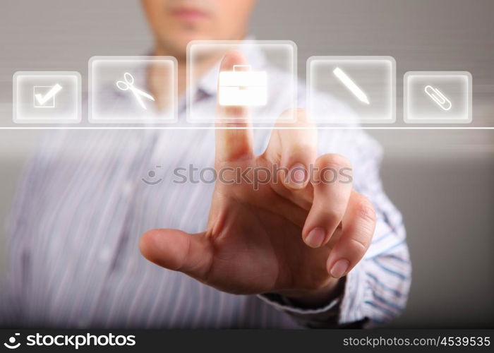 Human hand touching screen with buttons on it