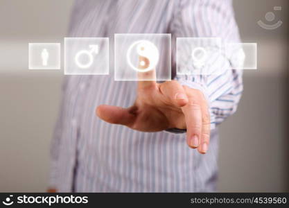 Human hand touching screen with buttons on it