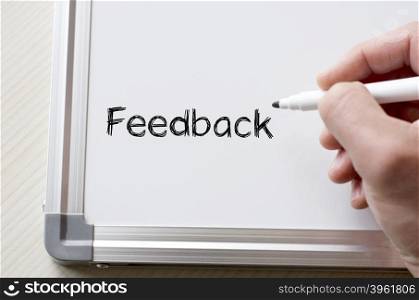 Human hand writing feedback on whiteboard