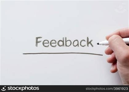 Human hand writing feedback on whiteboard
