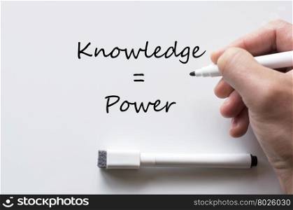 Human hand writing knowledge and power on whiteboard