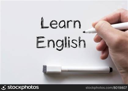 Human hand writing learn english on whiteboard