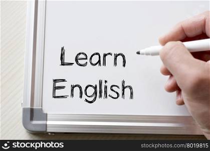 Human hand writing learn english on whiteboard