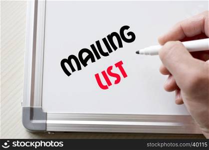 Human hand writing mailing list on whiteboard