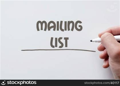 Human hand writing mailing list on whiteboard