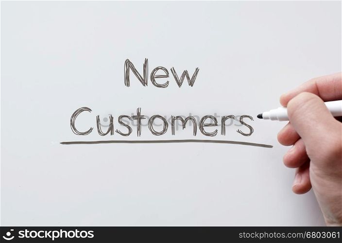 Human hand writing new customers on whiteboard