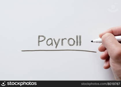 Human hand writing payroll on whiteboard