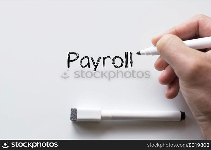 Human hand writing payroll on whiteboard