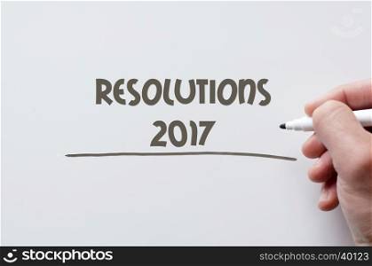 Human hand writing resolutions 2017 on whiteboard