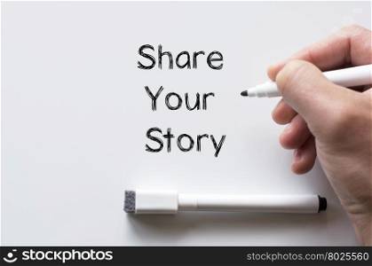 Human hand writing share your story on whiteboard