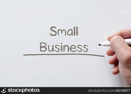 Human hand writing small business on whiteboard