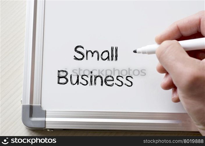 Human hand writing small business on whiteboard
