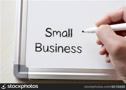 Human hand writing small business on whiteboard