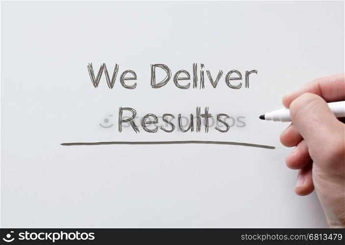 Human hand writing we deliver results on whiteboard