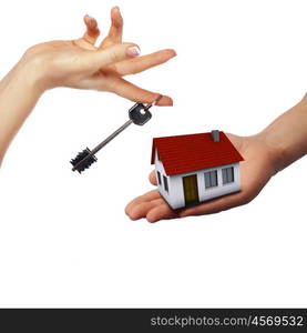 human hands holding model of a house against nature background