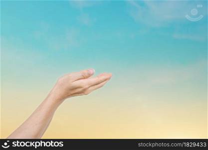 Human hands reaching for the sky sunset background. Hope concept