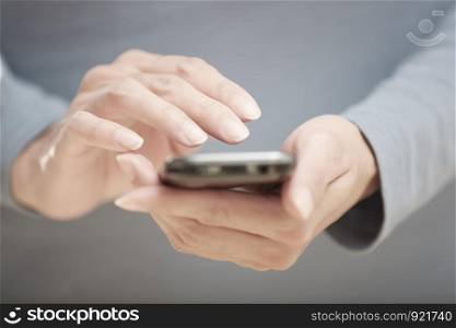 Human hands using smartphone with wi-fi Internet