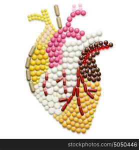 Human heart shape of pills, isolated on white.