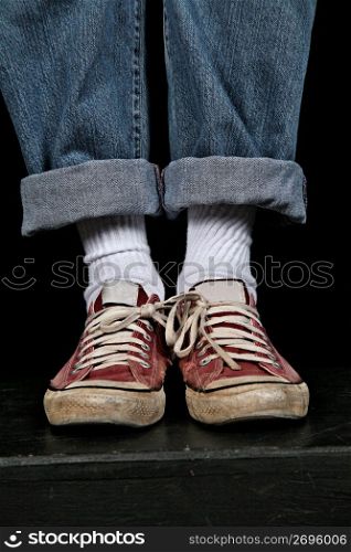 Human legs wearing shoes, low section