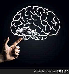 Human mind. Human hand pointing with finger at brain icon