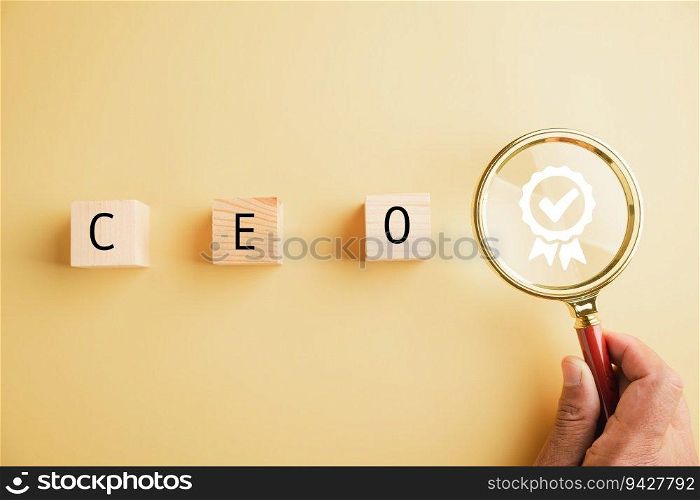 Human resources officer searches for leader and CEO with magnifying glass. HR manager selects employee. HR, HRM, HRD concepts. Wooden circle with CEO text. The photo depicts talent search in HR.