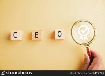 Human resources officer searches for leader and CEO with magnifying glass. HR manager selects employee. HR, HRM, HRD concepts. Wooden circle with CEO text. The photo depicts talent search in HR.