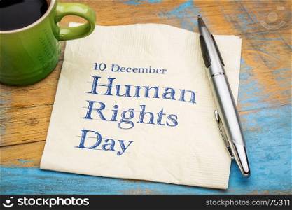 Human Rights Day (10 December) - handwriting on a napkin with a cup of coffee