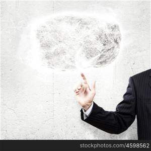 Human strength and power. Businessman in suit pointing at huge stone