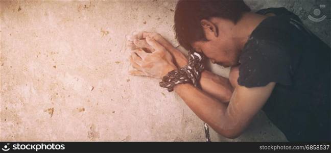 human trafficking, hands tied together with rope