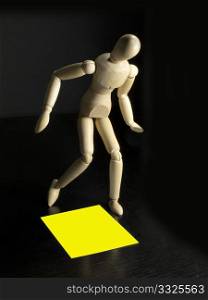 humanoid with a yellow sign on the floor by his feet