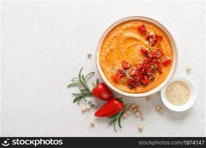 Hummus. Chickpea sauce with baked paprika. Top view.