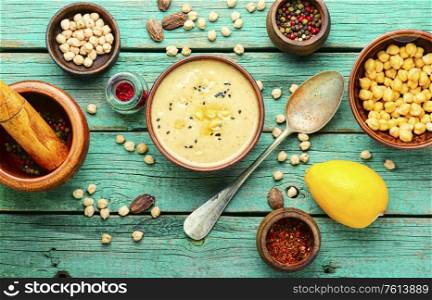 Hummus,cold appetizer of chickpeas puree.Hummus,chickpea,with spices.Popular Eastern food.. Bowl of hummus