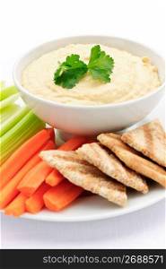 Hummus with pita bread and vegetables