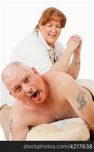 Humorous photo of a man surprised by a painful massage from an overly enthusiastic masseuse.